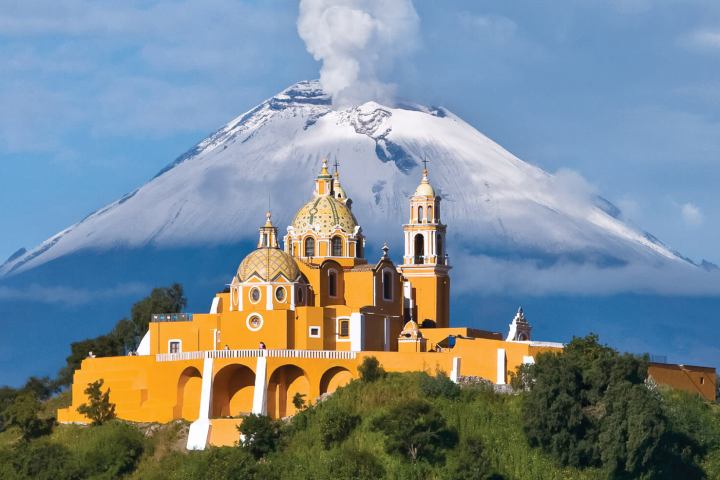 a castle with a mountain in the background